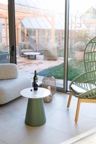 a living room with a couch and a table and chairs at Weinlandhof in Gamlitz