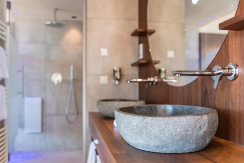 Ein Badezimmer in der Unterkunft Hotel Rosengarten (Schenna Resort)