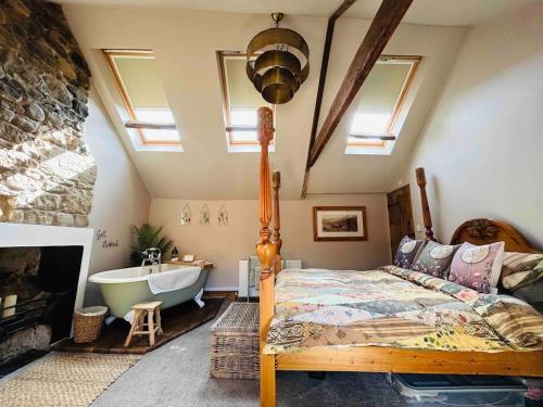 Ein Bett oder Betten in einem Zimmer der Unterkunft The Old Dairy Cottage