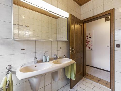 a bathroom with a sink and a mirror at Alluring Apartment in Schönsee in the forest in Schönsee