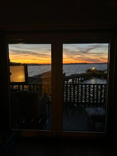 a view of the ocean from a room with a window at Woonboot De Witte loosdrechtse plassen in Loosdrecht