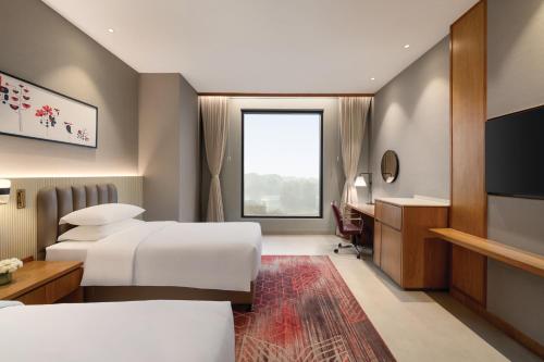Postel nebo postele na pokoji v ubytování Ramada by Wyndham Ranchi