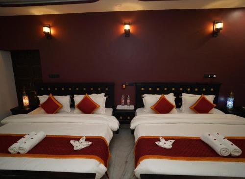 Postel nebo postele na pokoji v ubytování Hotel Bhanwar Haveli