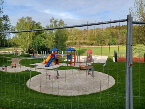 a park with a playground with a slide at Ferienhaus in der Nähe der Skipiste in Stadlern