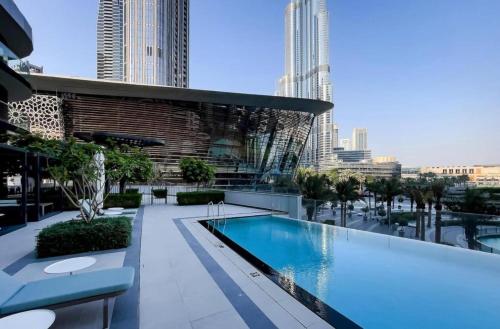 a swimming pool on the roof of a building at Grande Downtown Dubai Luxury 2BR Apt with Burj Khalifa & Dubai Fountain Views in Dubai