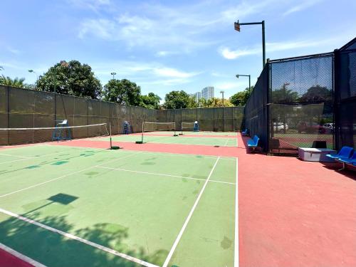 a tennis court with two tennis rackets on it at Great 2bedroom Apt Quick To My Dinh And Marriott Hotel, 30 Minutes To Airport in Hanoi