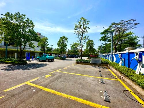 a parking lot with a car parked in it at Great 2bedroom Apt Quick To My Dinh And Marriott Hotel, 30 Minutes To Airport in Hanoi