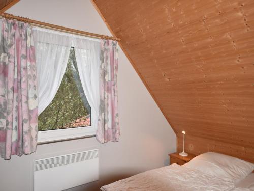 Ένα ή περισσότερα κρεβάτια σε δωμάτιο στο Ferienhaus in der Naehe der Ostsee