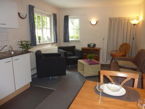 a living room with a kitchen and a living room at House situated on a magnificent estate in Barvaux