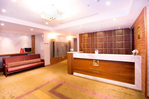 Postel nebo postele na pokoji v ubytování Muzik Hotel - Ximending Xining Branch