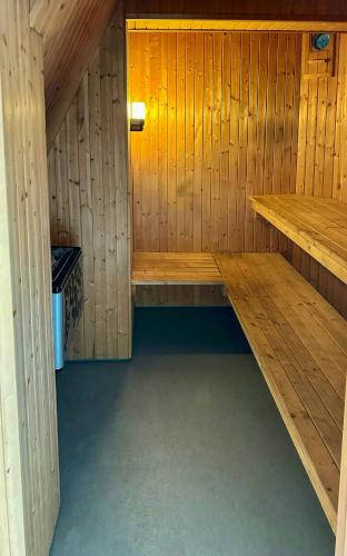 a inside of a sauna with a bench in it at 18Th Century House With Glass Porch In Småland in Söderåkra