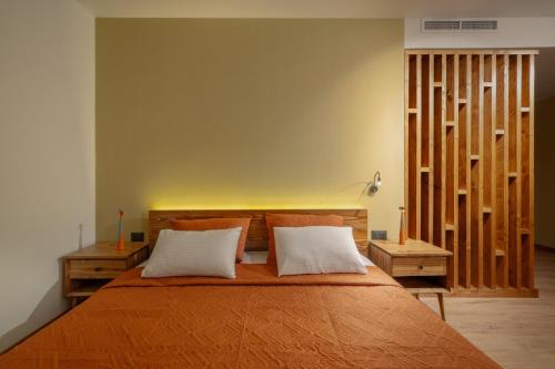 Postel nebo postele na pokoji v ubytování Aprie Boutique Hotel