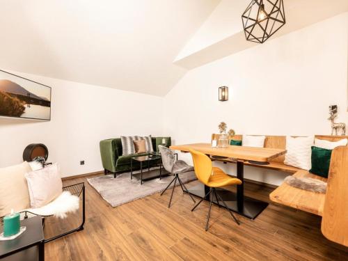 a living room with a table and chairs at Apartment in Strass im Zillertal in a beautiful setting in Strass im Zillertal