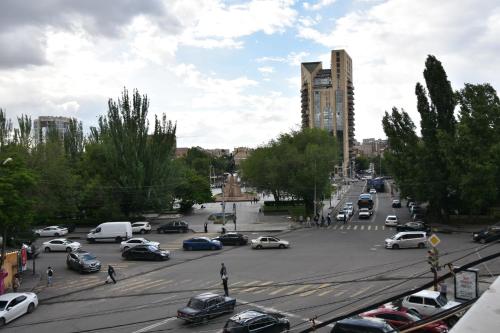 a busy city street filled with lots of cars at Dreem House in Yerevan