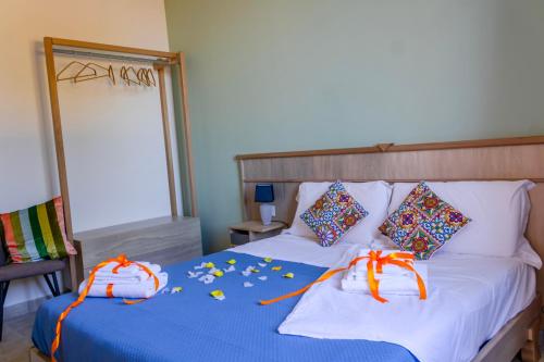 a bedroom with a bed with decorations on it at Stella del Rio in Naro