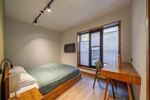 Postel nebo postele na pokoji v ubytování Aprie Boutique Hotel
