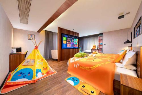 a bedroom with a large bed with a toy tent at Songshan Lake Minshu Villa 