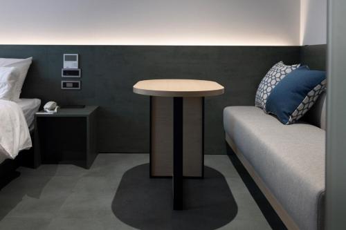 Postel nebo postele na pokoji v ubytování Aank Hotel Suwon Station