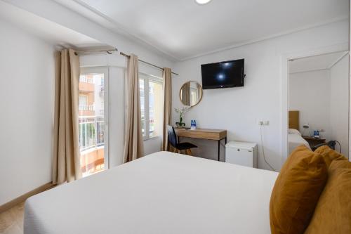 Letto o letti in una camera di Hotel Madrid