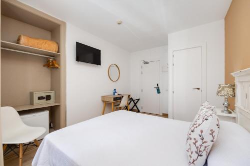 Letto o letti in una camera di Hotel Madrid