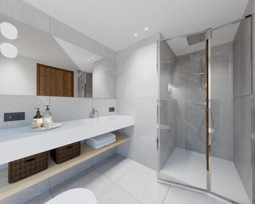 a white bathroom with a shower and a sink at Hotel Astoria in Livigno