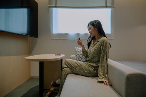TV a/nebo společenská místnost v ubytování Aank Hotel Suwon Station
