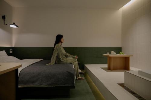 Postel nebo postele na pokoji v ubytování Aank Hotel Suwon Station