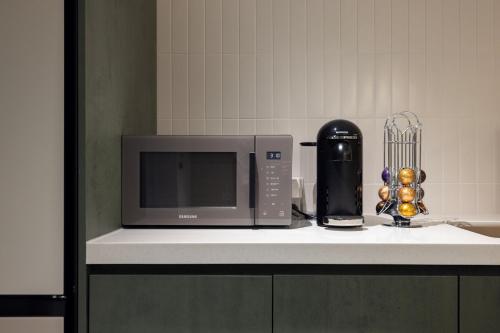 Kuchyň nebo kuchyňský kout v ubytování Aank Hotel Suwon Station