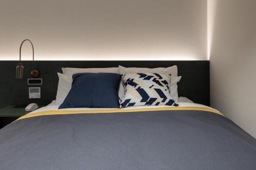 Postel nebo postele na pokoji v ubytování Aank Hotel Suwon Station