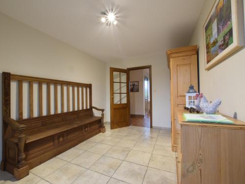 a living room with a bench and a hallway at Holiday Home in Gouvy Ardennes with Sauna in Rogery