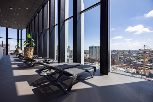 a row of chairs in a building with windows at Fletcher Wellness-Hotel Leiden in Leiden
