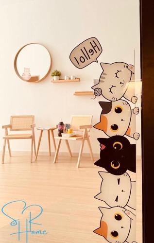 a door with a group of cats decals in a room at Sunway GRID by SR Home in Kampong Pendas
