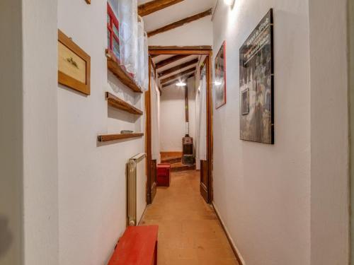 a long hallway with a red bench on a wall at Holiday Home with Garden and shared pool in Migliorini