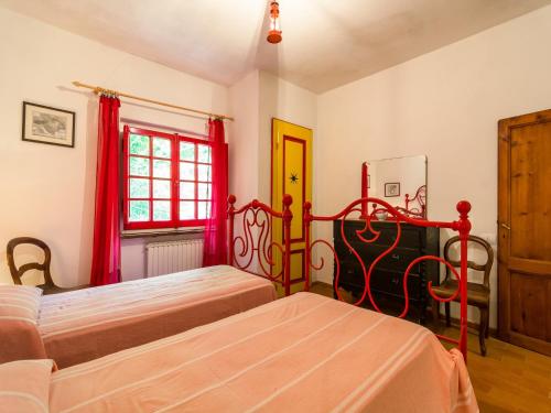 a bedroom with two beds and a window at Holiday Home with Garden and shared pool in Migliorini