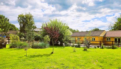 a house in a yard with a green field at The Stables, Winksley Nr Grantley Hall in Winksley