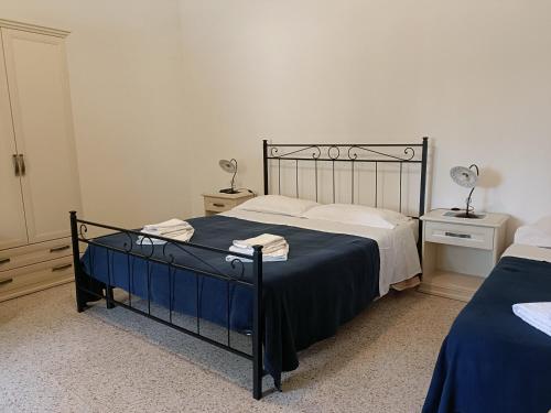 Ένα ή περισσότερα κρεβάτια σε δωμάτιο στο La Ferula Bed&Pool