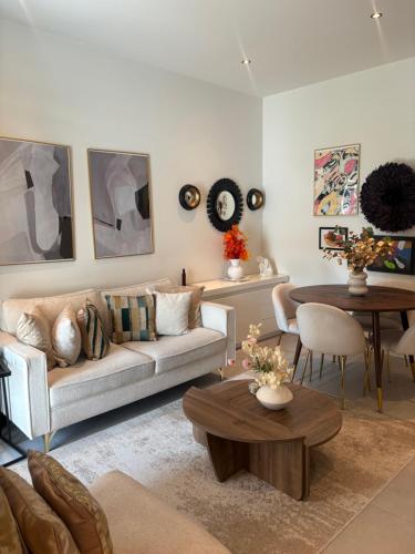 a living room with a couch and a table at Cosy appartement in Antwerp
