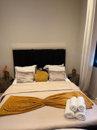 a bedroom with a bed with towels on it at Cosy appartement in Antwerp