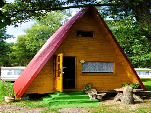 a small house with a red roof at Summer house for 4 people, close to the sea in Łazy