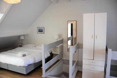 Postel nebo postele na pokoji v ubytování FLATS aparthotel
