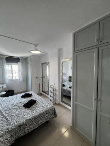 a bedroom with a bed and a large closet at Tagora del Guayero in Los Cristianos