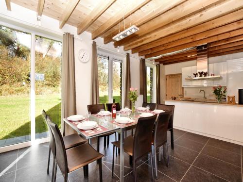 a kitchen and dining room with a table and chairs at Cosy Holiday Home in Durbuy with Garden in Durbuy