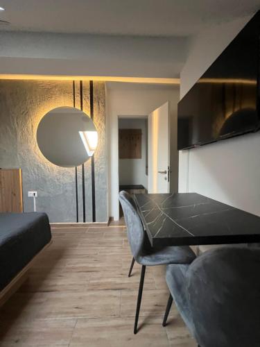 a living room with a table and a couch at LiboroApartments in Niš