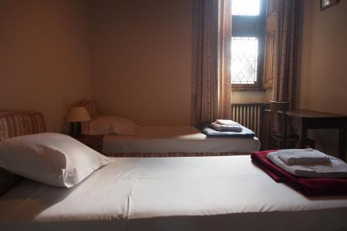 Ein Bett oder Betten in einem Zimmer der Unterkunft Un château au pays de d'Artagnan