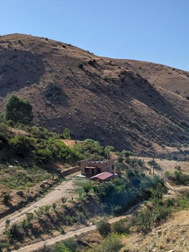 a house on the side of a hill at Cottage near Noravank, Areni, Sauna, Wine in Areni