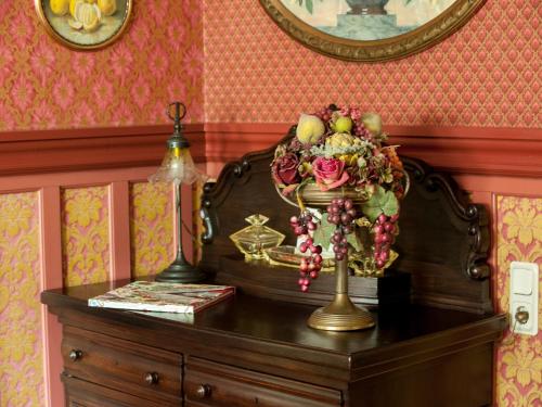 a table with a bouquet of fruit on top of it at Timeless Charm in Gernrode in Gernrode - Harz