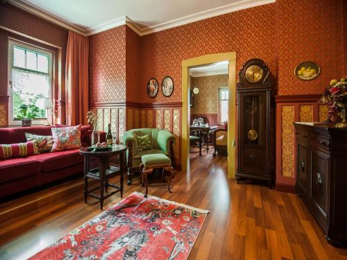 a living room with a couch and a table at Timeless Charm in Gernrode in Gernrode - Harz