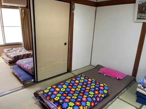 Letto o letti in una camera di AnNam Stay HOTARUGAIKE - - whole two story house rental