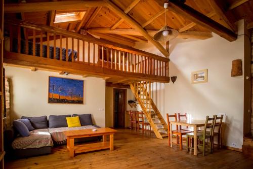 a living room with a couch and a table at Casa Somoza in Castrillo De Los Polvazares