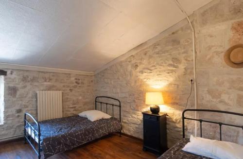 Postel nebo postele na pokoji v ubytování Charmante location avec piscine partagée à Orgnac-l'Aven, 60 m²tr